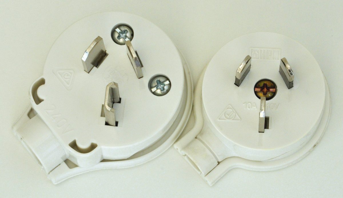 Two mains plugs of different pin sizes shown for comparison.